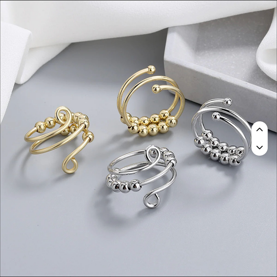 Galenée Stillpoint Coil Rings in gold and silver with gliding beads